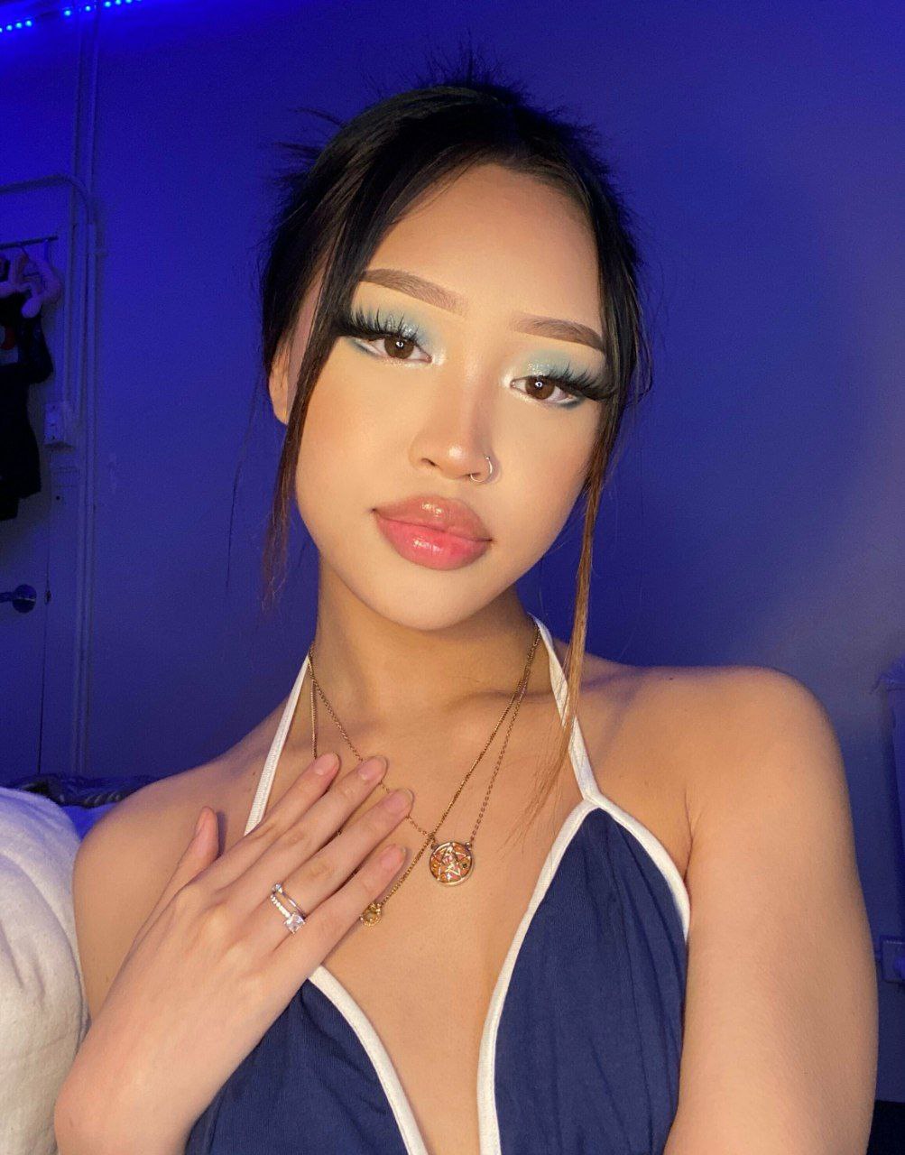 Blue Velvet Dreams: How to Rock a Luxurious Statement Halter Dress with Bold Makeup