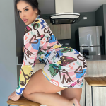 Emerald Green Bohemian Maxi Dress with Gold Embroidery and Suede Boots for a Free-Spirited Boho Chic Look